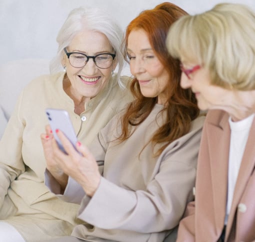 Three women on a video call on a mobile phone